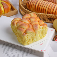 Juguete sensorial blando de pan de crecimiento lento con un aplastamiento súper suave y premium para aliviar el estrés.