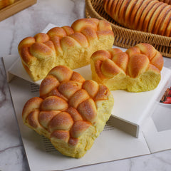 Juguete sensorial blando de pan de crecimiento lento con un aplastamiento súper suave y premium para aliviar el estrés.