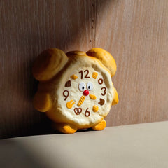 Juguete sensorial antiestrés de alta calidad con forma de reloj amarillo, suave y de rebote lento.