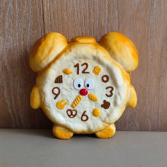 Juguete sensorial antiestrés de alta calidad con forma de reloj amarillo, suave y de rebote lento.